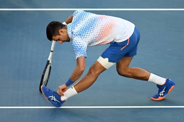 TENNIS AUSTRALIAN OPEN, Novak Djokovic of Serbia stretches before the Men?s semi final match against Tommy Paul of the United States at the 2023 Australian Open tennis championship at Melbourne Park in Melbourne, Thursday, January 26, 2023. ( NO ARCHIVING, EDITORIAL USE ONLY, NO USE IN BOOKS WITHOUT CONSENT MELBOURNE VICTORIA AUSTRALIA  Copyright: xJOELxCARRETTx 20230127001757095409