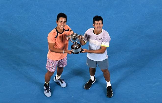 TENNIS AUSTRALIAN OPEN, Australian?s Rinky Hijikata (left) and Jason Kubler pose for photographs after winning the men?s doubles final against Hugo Nys of Monaco and Jan Zielinski of Poland at the 2023 Australian Open tennis championship at Melbourne Park in Melbourne, Saturday, January 28, 2023. ( NO ARCHIVING, EDITORIAL USE ONLY, NO USE IN BOOKS WITHOUT CONSENT MELBOURNE VICTORIA AUSTRALIA  Copyright: xLUKASxCOCHx 20230129001757547836