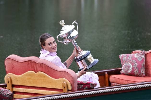 Aryna Sabalenka, BLR, presenting her trophy during a photoshoot in the botanical gardens after 2023 Australian Open in Melbourne, 29 01 2023