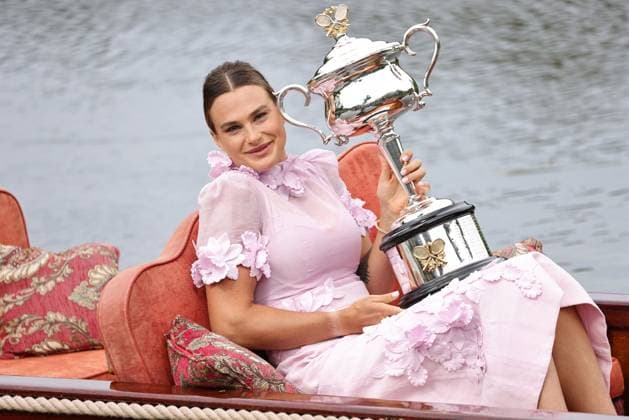 Aryna Sabalenka, BLR, presenting her trophy during a photoshoot in the botanical gardens after 2023 Australian Open in Melbourne, 29 01 2023