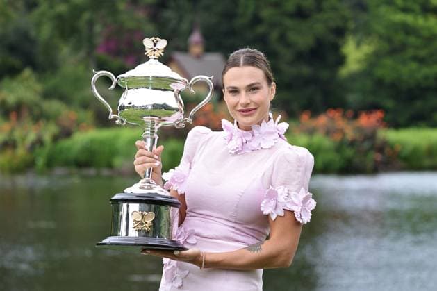 Aryna Sabalenka, BLR, presenting her trophy during a photoshoot in the botanical gardens after 2023 Australian Open in Melbourne, 29 01 2023