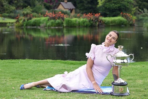 Aryna Sabalenka, BLR, presenting her trophy during a photoshoot in the botanical gardens after 2023 Australian Open in Melbourne, 29 01 2023
