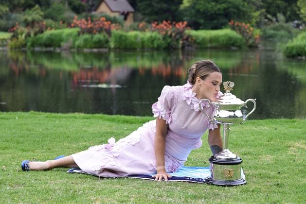 Aryna Sabalenka, BLR, presenting her trophy during a photoshoot in the botanical gardens after 2023 Australian Open in Melbourne, 29 01 2023