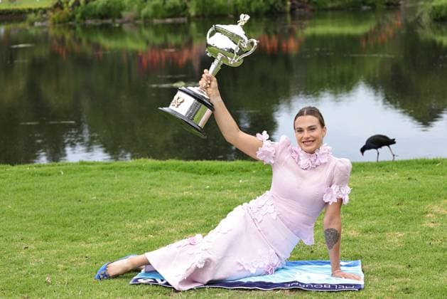 Aryna Sabalenka, BLR, presenting her trophy during a photoshoot in the botanical gardens after 2023 Australian Open in Melbourne, 29 01 2023