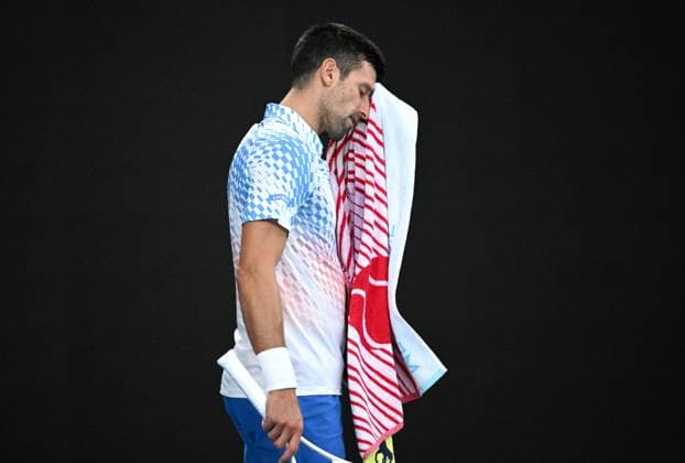 TENNIS AUSTRALIAN OPEN, Novak Djokovic of Serbia recovers during the men?s singles final against Stefanos Tsitsipas of Greece at the 2023 Australian Open tennis championship at Melbourne Park in Melbourne, Sunday, January 29, 2023. ( NO ARCHIVING, EDITORIAL USE ONLY, NO USE IN BOOKS WITHOUT CONSENT MELBOURNE VICTORIA AUSTRALIA  Copyright: xJamesxRossx 20230129001757881238