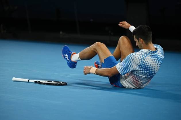 TENNIS AUSTRALIAN OPEN, Novak Djokovic of Serbia stumbles during the Men?s Singles Final against Stefanos Tsitsipas of Greece at the 2023 Australian Open tennis tournament at Melbourne Park in Melbourne, Sunday, January 29, 2023. ( NO ARCHIVING, EDITORIAL USE ONLY, NO USE IN BOOKS WITHOUT CONSENT MELBOURNE VICTORIA AUSTRALIA  Copyright: xJOELxCARRETTx 20230129001757890118