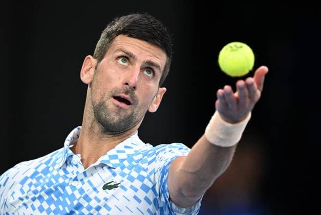TENNIS AUSTRALIAN OPEN, Novak Djokovic of Serbia prepares to serve to Stefanos Tsitsipas of Greece during the men?s singles final at the 2023 Australian Open tennis championship at Melbourne Park in Melbourne, Sunday, January 29, 2023. ( NO ARCHIVING, EDITORIAL USE ONLY, NO USE IN BOOKS WITHOUT CONSENT MELBOURNE VICTORIA AUSTRALIA  Copyright: xJamesxRossx 20230129001757890321