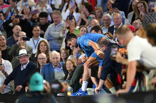 TENNIS AUSTRALIAN OPEN, Novak Djokovic of Serbia is assisted from the players box winning the men?s singles final against Stefanos Tsitsipas of Greece at the 2023 Australian Open tennis championship at Melbourne Park in Melbourne, Sunday, January 29, 2023. ( NO ARCHIVING, EDITORIAL USE ONLY, NO USE IN BOOKS WITHOUT CONSENT MELBOURNE VICTORIA AUSTRALIA  Copyright: xJamesxRossx 20230129001757912277