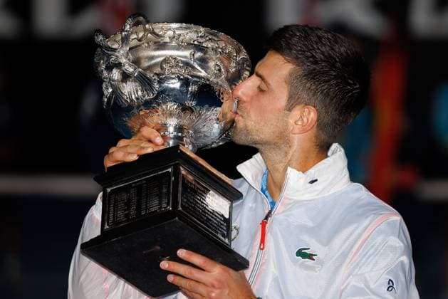 January 29, 2023: The MenÃ¢â‚¬â ¢s Singles Champion NOVAK DJOKOVIC of Serbia pose for photos with the trophy after defeating STEFANOS TSITSIPAS of Greece on Rod Laver Arena on day 14 of the 2023 Australian Open in Melbourne, Australia. Cal Media USA - ZUMAc04_ 20230129_zaf_c04_019 Copyright: xSydneyxLowx