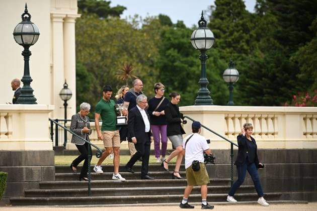 TENNIS AUSTRALIAN OPEN MENS SINGLES WINNER, Novak Djokovic of Serbia (2nd left) and Victoria Governor Linda Dessau (left) arriving to pose for a photograph with the Norman Brooks Challenge Cup following his win in the men?s singles final in the 2023 Australian Open tennis tournament, at Government House in Melbourne, Monday, January 30, 2023. ( NO ARCHIVING, EDITORIAL USE ONLY, NO USE IN BOOKS WITHOUT CONSENT MELBOURNE VICTORIA AUSTRALIA  Copyright: xJAMESxROSSx 20230130001758172856