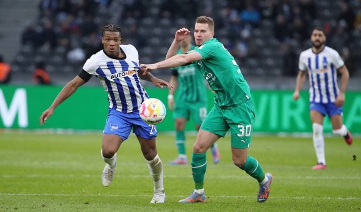 Jessic Ngankam, Nico Elvedi duel match scene action sports football soccer DFL Bundesliga men 20 match day season 2022 2023 12 02 2023 Hertha BSC Berlin vs Borussia Mönchengladbach BMG
