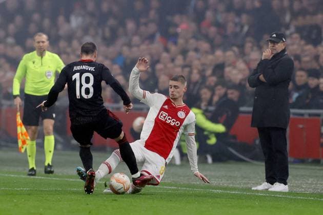 AMSTERDAM, 16-02-2023 , JohanCruyff Arena, season 2022 2023 , Europa League match between Ajax and Union Berlin, Union Berlin player Josip Juranovic with Ajax player Kenneth Taylor during the match Ajax - Union Berlin Ajax - Union Berlin  x19917415x Copyright: