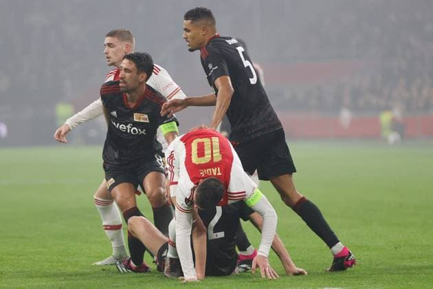 AMSTERDAM, 16-02-2023 , JohanCruyff Arena, season 2022 2023 , Europa League match between Ajax and Union Berlin, Ajax player Dusan Tadic with Union Berlin player Danilho Doekhi and Union Berlin player Rani Khedira during the match Ajax - Union Berlin Ajax - Union Berlin  x19917526x Copyright: