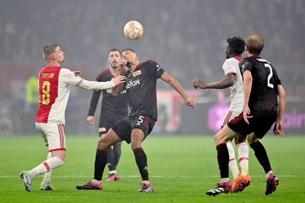 AMSTERDAM, 16-02-2023 , JohanCruyff Arena, season 2022 2023 , Europa League match between Ajax and Union Berlin, Ajax player Kenneth Taylor with Union Berlin player Danilho Doekhi during the match Ajax - Union Berlin Ajax - Union Berlin  x19917529x Copyright: