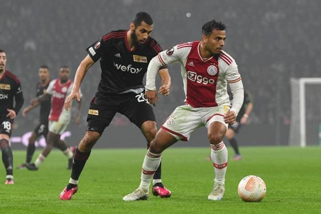 Football, men, season 2022 2023, Europa League Play Offs to the round of 16, first leg , Ajax Amsterdam 1 FC Union Berlin, v l Aissa Laidouni 1 FC Union Berlin and Owen Wijndal Ajax Amsterdam in duel , 16 02 2023, Copyright: xMatthiasxKochx
