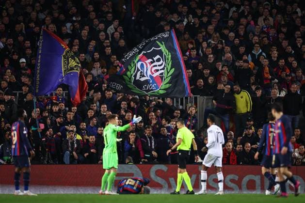 Mandatory Credit: Photo by Simon Dael Shutterstock (13765759ae) Barcelona fans look on as b4 goes down injured Barcelona v Manchester United, ManU UEFA Europa League, Play-Off Round, First Leg, Football, Camp Nou, Barcelona, Spain - 16 Feb 2023 EDITORIAL USE ONLY No use with unauthorised audio, video, data, fixture lists, club league logos or live services. Online in-match use limited to 120 images, no video emulation. No use in betting, games or single club league player publications. Barcelona v Manchester United, UEFA Europa League, Play-Off Round, First Leg, Football, Camp Nou, Barcelona, Spain - 16 Feb 2023 EDITORIAL USE ONLY No use with unauthorised audio, video, data, fixture lists, club league logos or live services. Online in-match use limited to 120 images, no video emulation. No use in betting, games or single club league player publications. Copyright: xSimonxDael Shutterstockx 13765759ae
