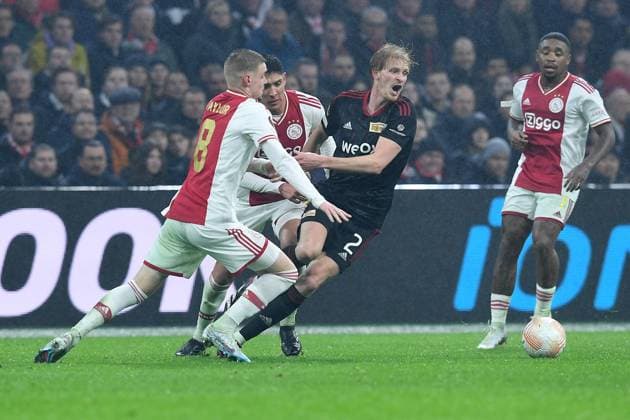 Soccer Europa League K o round Play off Ajax Amsterdam 1 FC Union Berlin on 16 02 2023 at the Johan Cruijff ArenA in Amsterdam Kenneth Taylor Amsterdam , left Morten Thorsby Berlin , right xRx