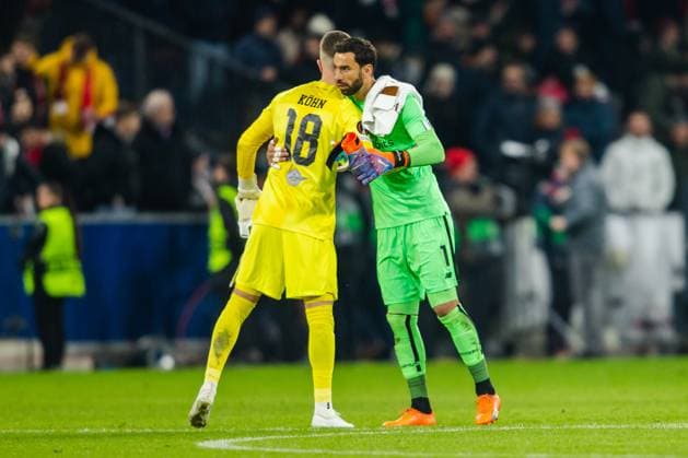 SOCCER - UEFA EL, RBS vs Roma SALZBURG,AUSTRIA,16.FEB.23 - SOCCER - UEFA Europa League, play off, Red Bull Salzburg vs AS Roma. Image shows Philipp Koehn (RBS) and Rui Patricio (Roma).  GEPAxpictures xGintarexKarpaviciute