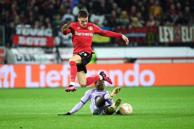Florian Wirtz Bayer 04 Leverkusen , li , against Mohamed Camara AS Monaco 16 02 2023, Football Europa League, season 2022 23, K o rounds play off, Bayer 04 Leverkusen AS Monaco Leverkusen BayArena Nordrhein Westfalen Germany Team2