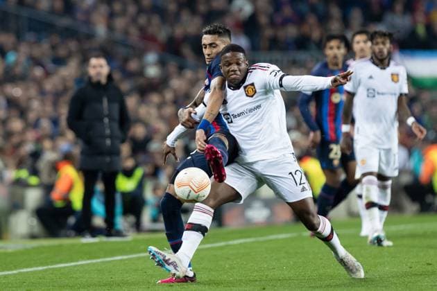 BARCELONA, SPAIN - FEBRUARY 16: Raphinha of FC Barcelona, Barca in action with Tyrell Malacia of Manchester United, ManU during the UEFA Europa League knockout round play-off leg one match between FC Barcelona and Manchester United at Spotify Camp Nou on February 16, 2023 in Barcelona, Spain. SPO 