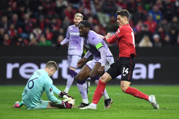 Soccer Europa League K o round Play off Bayer 04 Leverkusen AS Monaco on 16 02 2023 in the BayArena in Leverkusen Alexander Nübel Monaco , left Axel Disasi Monaco , center Patrik Schick Leverkusen , right xHDx