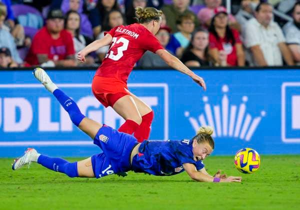 ORLANDO, FL - FEBRUARY 16: the United States defender Emily Sonnett (14) defends and gets fouled during the She Believes soccer match between the USA and Canada on February 16, 2022 at Explorer Stadium in Orlando, FL. (Photo by Andrew Bershaw Icon Sportswire) SOCCER: FEB 16 Women™s SheBelieves Cup - USA vs Canada Icon2302160156
