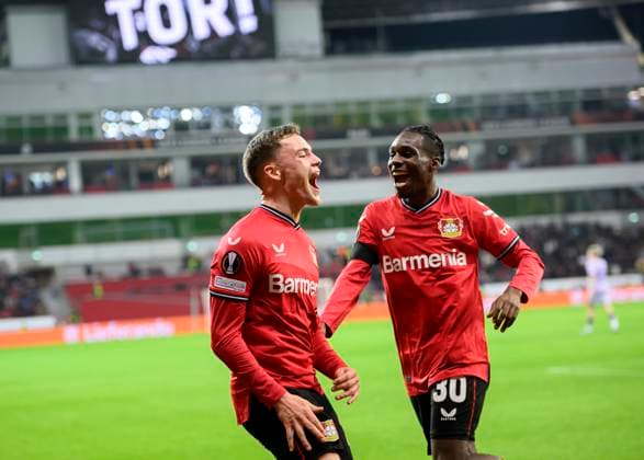 Cheers Florian WIRTZ LEV after his goal to 2 1, r Jeremie FRIMPONG LEV Football Europa League, K o round Play off first leg, Bayer 04 Leverkusen LEV AS Monaco, on 16 02 2023 in Leverkusen Germany UEFA regulations prohibit any use of photographs as image sequences and or quasi video Â