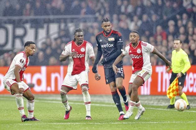 AMSTERDAM, 16-02-2023 , JohanCruyff Arena, season 2022 2023 , Europa League match between Ajax and Union Berlin 0-0. Ajax player Jurrien Timber Ajax player Calvin Bassey, Ajax player Steven Bergwijn, Union Berlin player Jordan Siebatcheu Ajax - Union Berlin  x19923153x Copyright: