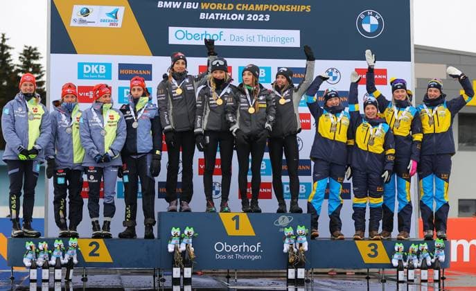 BIATHLON - IBU WC Oberhof OBERHOF,GERMANY,19.FEB.23 - BIATHLON - IBU World Championships 2023, 4x6 km relay, ladies, award ceremony. Image shows the rejoicing of team Germany, team Italy and team Sweden. Keywords: medal.  GEPAxpictures xThomasxBachun