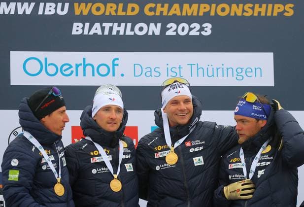BIATHLON - IBU WC Oberhof OBERHOF,GERMANY,19.FEB.23 - BIATHLON - IBU World Championships 2023, 4x7.5 km relay, men, award ceremony. Image shows the rejoicing of Quentin Fillon Maillet, Fabien Claude, Emilien Jacquelin and Antonin Guigonnat (FRA). Keywords: medal.  GEPAxpictures xThomasxBachun