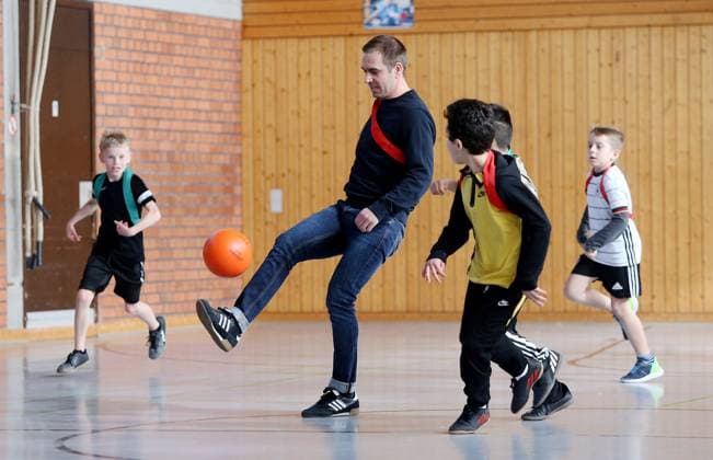 BAU 21 02 2023 Stuttgart Untertürkheim soccer media appointment UEFO Euro 2024 with tournament director Philipp Lahm and ambassador Celia Sasic, Philipp Lahm plays soccer with children