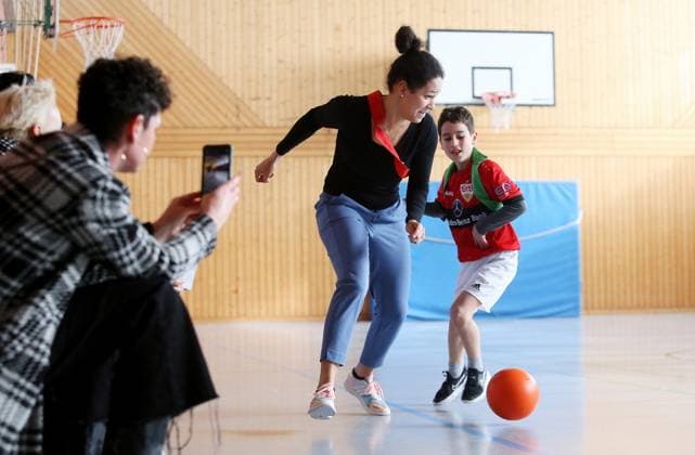 BAU 21 02 2023 Stuttgart Untertürkheim soccer media appointment UEFO Euro 2024 with tournament director Philipp Lahm and ambassador Celia Sasic, Celia Sasic left plays soccer with children