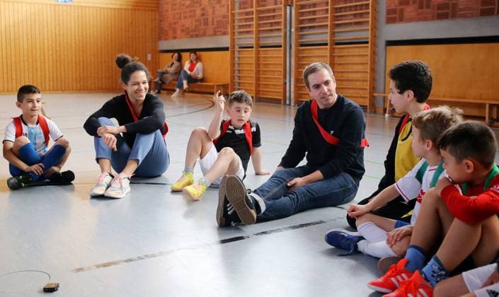 BAU 21 02 2023 Stuttgart Untertürkheim Soccer media event UEFO Euro 2024 with tournament director Philipp Lahm and ambassador Celia Sasic, Celia Sasic 2 f l and Philipp Lahm 4 f l answer questions from the children