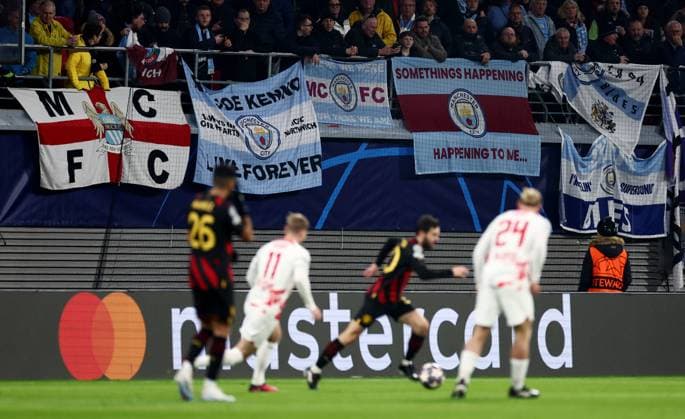 Mandatory Credit: Photo by James Marsh Shutterstock (13775724bs) Manchester City fans watch on. RB Leipzig v Manchester City, UEFA Champions League, Round of 16, First Leg, Football, Red Bull Arena, Leipzig, UK - 22 Feb 2023 EDITORIAL USE ONLY No use with unauthorised audio, video, data, fixture lists, club league logos or live services. Online in-match use limited to 120 images, no video emulation. No use in betting, games or single club league player publications. RB Leipzig v Manchester City, UEFA Champions League, Round of 16, First Leg, Football, Red Bull Arena, Leipzig, UK - 22 Feb 2023 EDITORIAL USE ONLY No use with unauthorised audio, video, data, fixture lists, club league logos or live services. Online in-match use limited to 120 images, no video emulation. No use in betting, games or single club league player publications. Copyright: xJamesxMarsh Shutterstockx 13775724bs