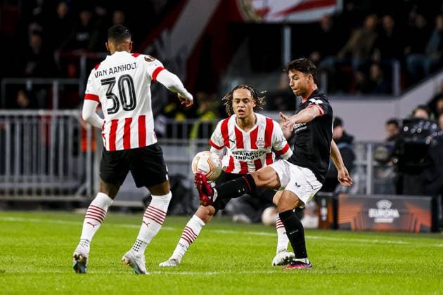 EINDHOVEN, 23-02-2023. Philips Stadion, Stadium of PSV. Europa League season 2022-2023. Second leg PSV - Sevilla, PSV player Patrick van Aanholt, PSV player Xavi Simons PSV - Sevilla  x19994645x Copyright: