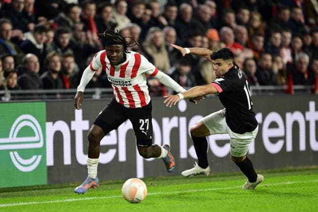 EINDHOVEN - (lr) Johan Bakayoko of PSV Eindhoven, Marcos Acuna of Sevilla FC during the UEFA Europa league play-off match between PSV Eindhoven and Sevilla FC at Phillips stadium on February 23, 2023 in Eindhoven, Netherlands. ANP OLAF KRAAK PSV Eindhoven v Sevilla FC: Knockout Round Play-Off Leg Two - UEFA Europa League 2022 2023 xVIxANPxSportx xxANPxIVx 463445563 originalFilename: 463445563.jpg