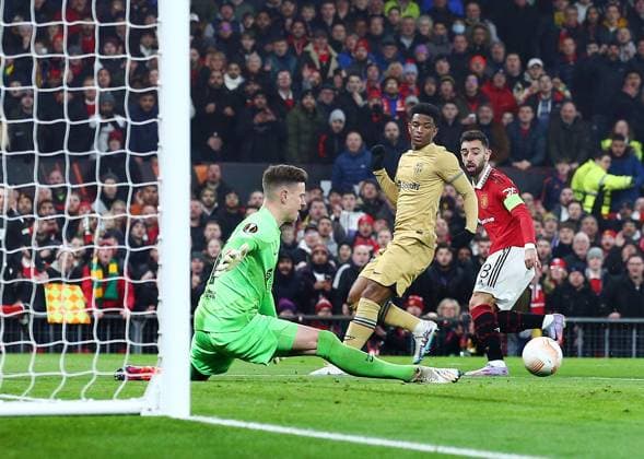 Mandatory Credit: Photo by Matt West Shutterstock (13775740k) Barcelona goalkeeper Marc-Andre ter Stegen makes a save from Bruno Fernandes of Manchester United, ManU Manchester United v Barcelona, UEFA Europa League, Play-Off Round, Second Leg, Football, Old Trafford, Manchester, UK - 23 Feb 2023 EDITORIAL USE ONLY No use with unauthorised audio, video, data, fixture lists, club league logos or live services. Online in-match use limited to 120 images, no video emulation. No use in betting, games or single club league player publications. Manchester United v Barcelona, UEFA Europa League, Play-Off Round, Second Leg, Football, Old Trafford, Manchester, UK - 23 Feb 2023 EDITORIAL USE ONLY No use with unauthorised audio, video, data, fixture lists, club league logos or live services. Online in-match use limited to 120 images, no video emulation. No use in betting, games or single club league player publications.  Copyright: xMattxWest Shutterstockx 13775740k