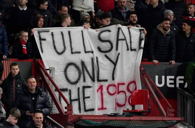 Manchester, England, 23rd February 2023. Manchester Utd fans display a banner against the current owners during the UEFA Europa League match at Old Trafford, Manchester. Picture credit should read: Andrew Yates Sportimage EDITORIAL USE ONLY. No use with unauthorised audio, video, data, fixture lists, club league logos or live services. Online in-match use limited to 120 images, no video emulation. No use in betting, games or single club league player publications. SPI-2256-0024