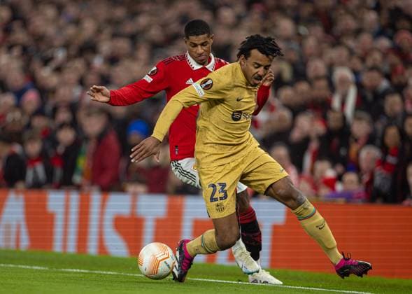 Football - UEFA Europa League - Play-Off 2nd Leg - Manchester United, ManU FC v FC Barcelona, Barca MANCHESTER, ENGLAND - Thursday, February 23, 2023: Manchester United s Marcus Rashford (L) takes on Barcelona s Jules KoundÃ during the UEFA Europa League Play-Off 2nd Leg game between Manchester United FC and FC Barcelona at Old Trafford. MANCHESTER Old Trafford GREATER MANCHESTER ENGLAND  Copyright: xDavidxRawcliffex P2023-02-23-Man_Utd_Barcelona-22