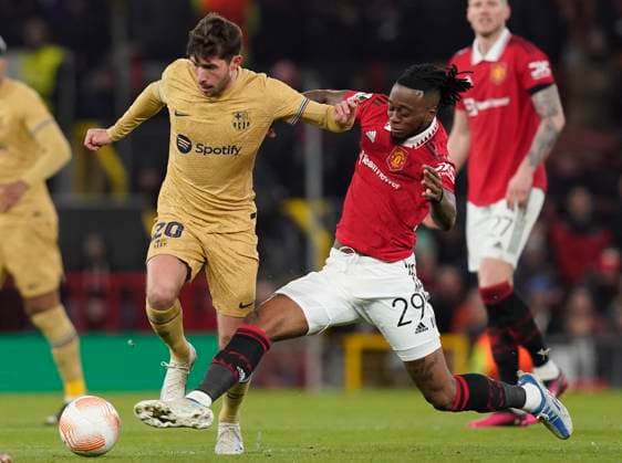Manchester, England, 23rd February 2023. Sergi Roberto of Barcelona tackled by Aaron Wan-Bissaka of Manchester United, ManU during the UEFA Europa League match at Old Trafford, Manchester. Picture credit should read: Andrew Yates Sportimage EDITORIAL USE ONLY. No use with unauthorised audio, video, data, fixture lists, club league logos or live services. Online in-match use limited to 120 images, no video emulation. No use in betting, games or single club league player publications. SPI-2256-0028