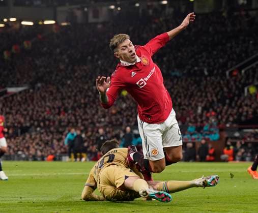 Manchester, England, 23rd February 2023. Lisandro Martinez of Manchester United, ManU clears under pressure from Sergi Roberto of Barcelona during the UEFA Europa League match at Old Trafford, Manchester. Picture credit should read: Andrew Yates Sportimage EDITORIAL USE ONLY. No use with unauthorised audio, video, data, fixture lists, club league logos or live services. Online in-match use limited to 120 images, no video emulation. No use in betting, games or single club league player publications. SPI-2256-0033