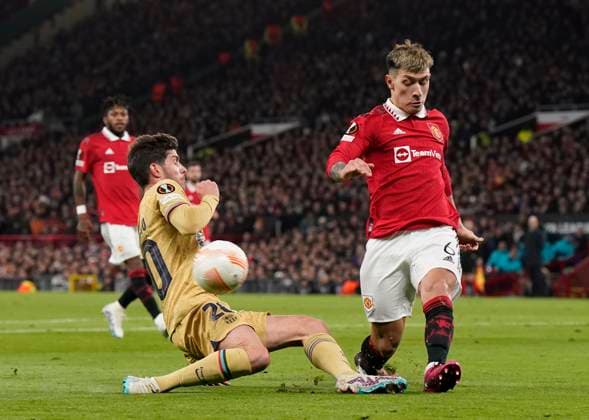 Manchester, England, 23rd February 2023. Lisandro Martinez of Manchester United, ManU clears under pressure from Sergi Roberto of Barcelona during the UEFA Europa League match at Old Trafford, Manchester. Picture credit should read: Andrew Yates Sportimage EDITORIAL USE ONLY. No use with unauthorised audio, video, data, fixture lists, club league logos or live services. Online in-match use limited to 120 images, no video emulation. No use in betting, games or single club league player publications. SPI-2256-0035
