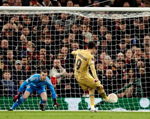 Football - 2022 2023 UEFA Europa League - Play-Off - Second Leg - Manchester United, ManU vs Barcelona - Old Trafford - Thursday 23rd February 2023 Robert Lewandowski of Barcelona scores from the penalty spot to put his team 1-0 ahead in the first half, at Old Trafford. 