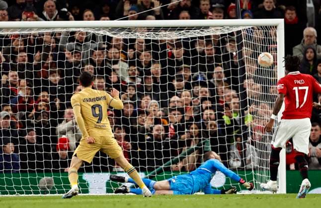 Football - 2022 2023 UEFA Europa League - Play-Off - Second Leg - Manchester United, ManU vs Barcelona - Old Trafford - Thursday 23rd February 2023 Robert Lewandowski of Barcelona scores from the penalty spot to put his team 1-0 ahead in the first half, at Old Trafford. 