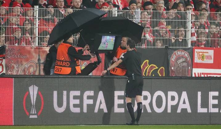 Referee Carlos Del Cerro Grande ESP uses VAR Video Assist Referee for possible handball penalty Sport Football UEL UEFA Europa League Men Season 2022 2023 23 02 2023 1 FC Union Berlin FCU vs Ajax Amsterdam DFL regulations prohibit any use of photographs as image sequences and or quasi video