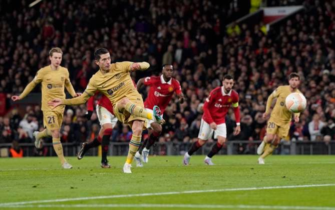Manchester, England, 23rd February 2023. Robert Lewandowski of Barcelona scores the first goal during the UEFA Europa League match at Old Trafford, Manchester. Picture credit should read: Andrew Yates Sportimage EDITORIAL USE ONLY. No use with unauthorised audio, video, data, fixture lists, club league logos or live services. Online in-match use limited to 120 images, no video emulation. No use in betting, games or single club league player publications. SPI-2256-0040