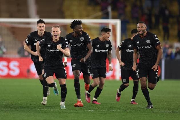 Monaco, Monaco, 23rd February 2023. Bayer Leverkusen players celebrate after Moussa Diaby of Bayer Leverkusen scored the winning penalty in the shoot out of the UEFA Europa League match at Stade Louis II, Monaco. Picture credit should read: Jonathan Moscrop Sportimage EDITORIAL USE ONLY. No use with unauthorised audio, video, data, fixture lists, club league logos or live services. Online in-match use limited to 120 images, no video emulation. No use in betting, games or single club league player publications. SPI-2233-0040