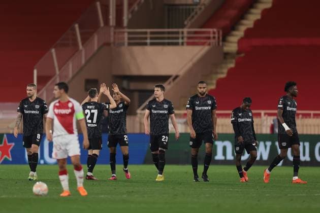 Monaco, Monaco, 23rd February 2023. Wissam Ben Yedder of AS Monaco reacts as Bayer Leverkusen players celebrate after after Amine Adli scored to give the side a 3-1 lead during the UEFA Europa League match at Stade Louis II, Monaco. Picture credit should read: Jonathan Moscrop Sportimage EDITORIAL USE ONLY. No use with unauthorised audio, video, data, fixture lists, club league logos or live services. Online in-match use limited to 120 images, no video emulation. No use in betting, games or single club league player publications. SPI-2233-0046