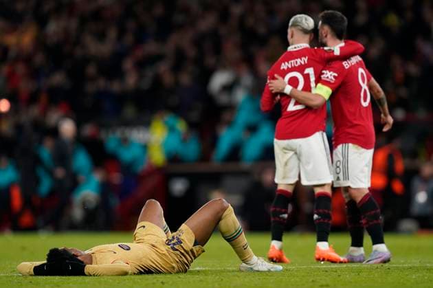 Manchester, England, 23rd February 2023. Alejandro Balde of Barcelona dejected as Antony of Manchester United, ManU and Bruno Fernandes of Manchester United celebrate during the UEFA Europa League match at Old Trafford, Manchester. Picture credit should read: Andrew Yates Sportimage EDITORIAL USE ONLY. No use with unauthorised audio, video, data, fixture lists, club league logos or live services. Online in-match use limited to 120 images, no video emulation. No use in betting, games or single club league player publications. SPI-2256-0104