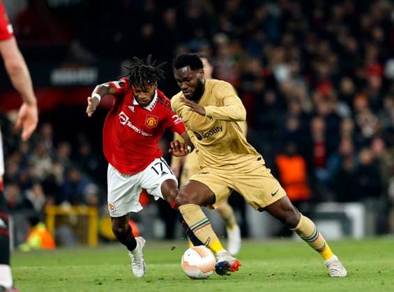 Football - 2022 2023 UEFA Europa League - Play-Off - Second Leg - Manchester United, ManU vs Barcelona - Old Trafford - Thursday 23rd February 2023 Franck Kessie of Barcelona takes on Fred of Manchester United, at Old Trafford. 